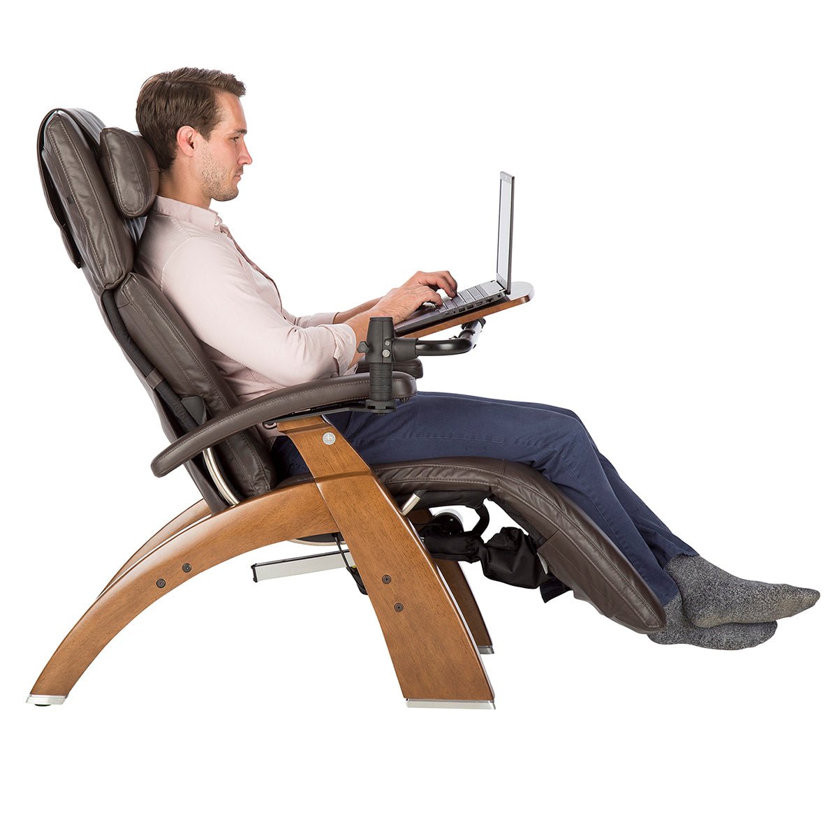 Person using Perfect Chair Laptop Desk attachment while reclining in ergonomic zero-gravity chair